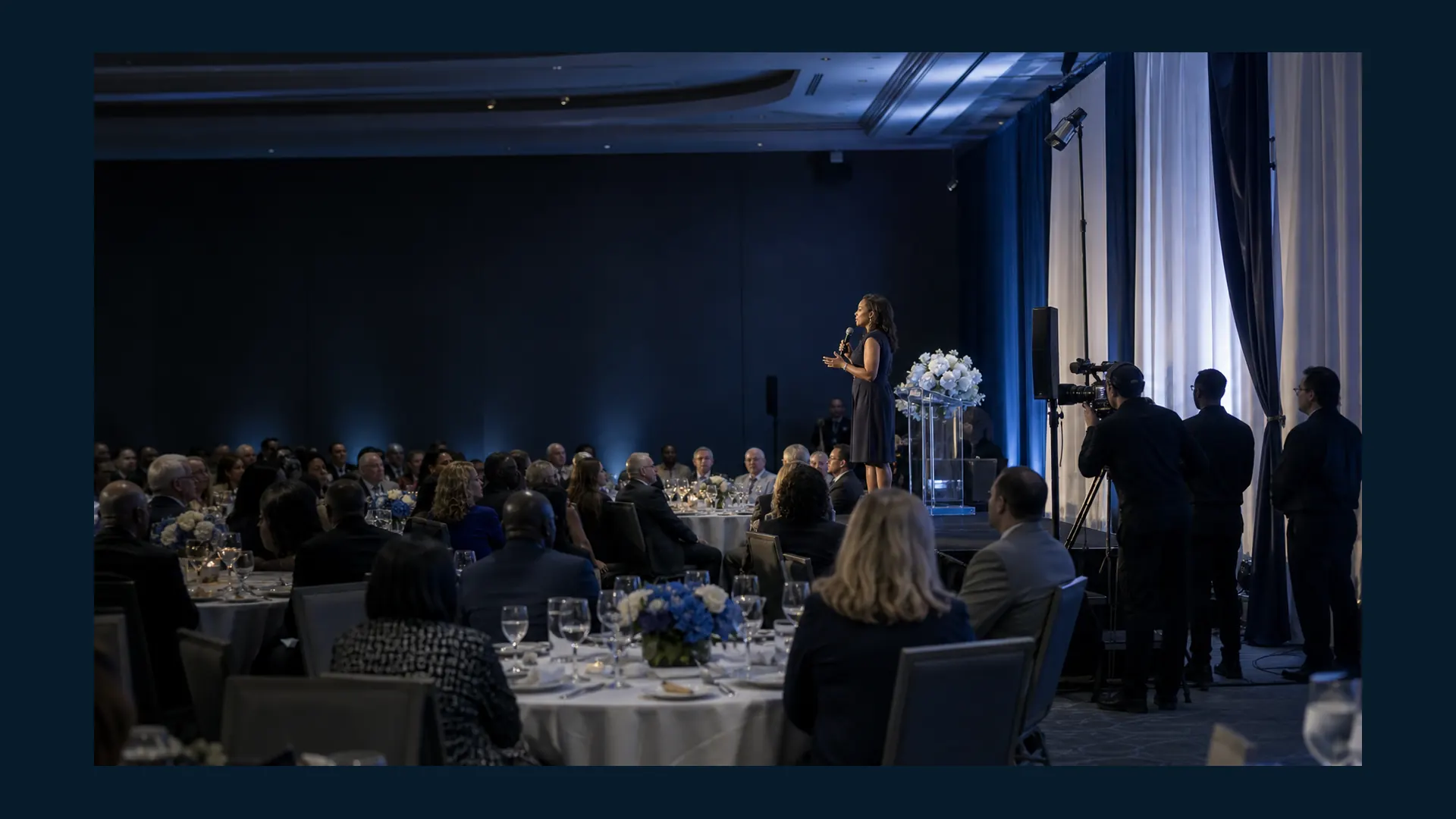 Nonprofit fundraising gala with a speaker on stage