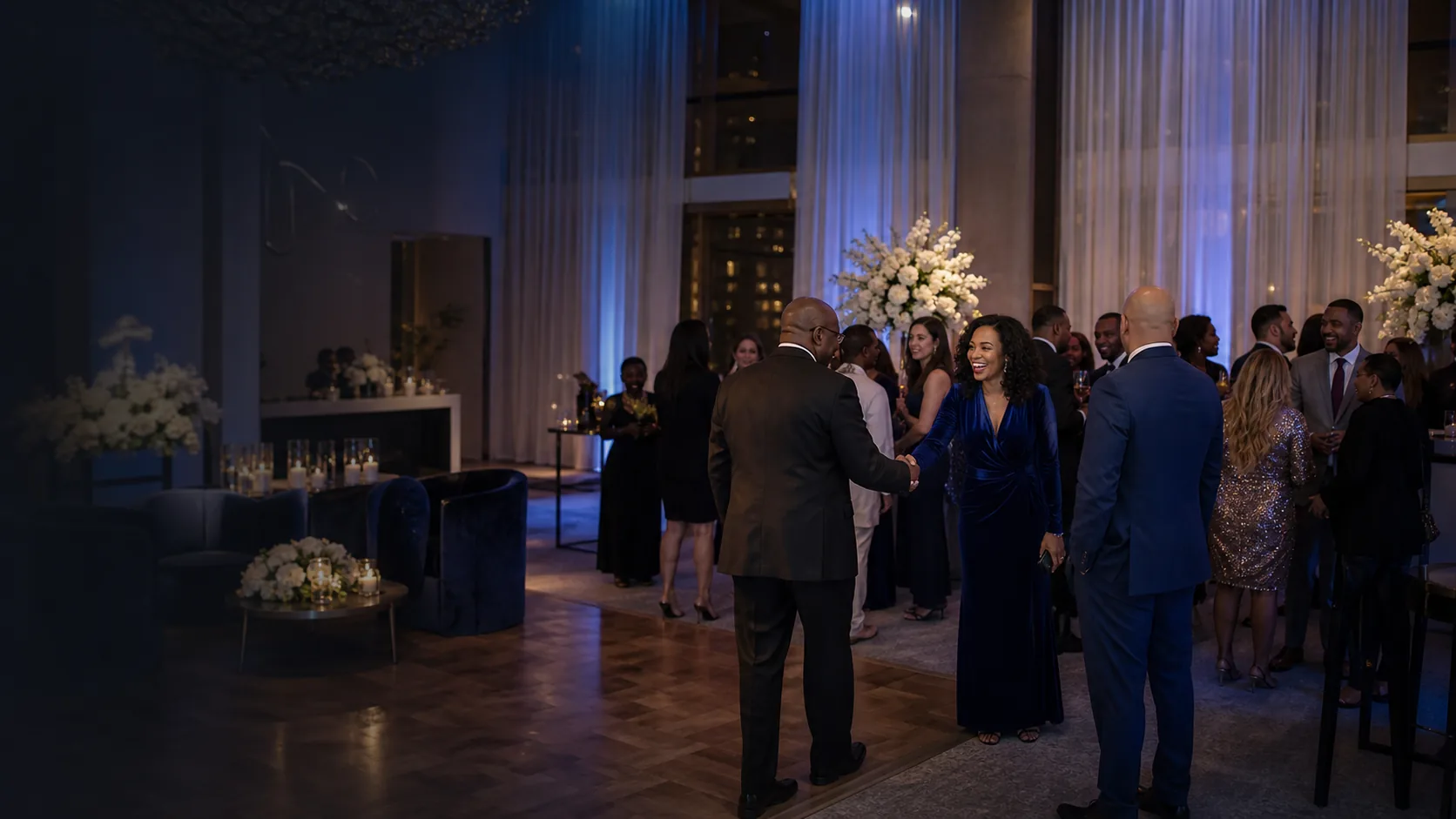 Upscale evening reception with guests and warm lighting