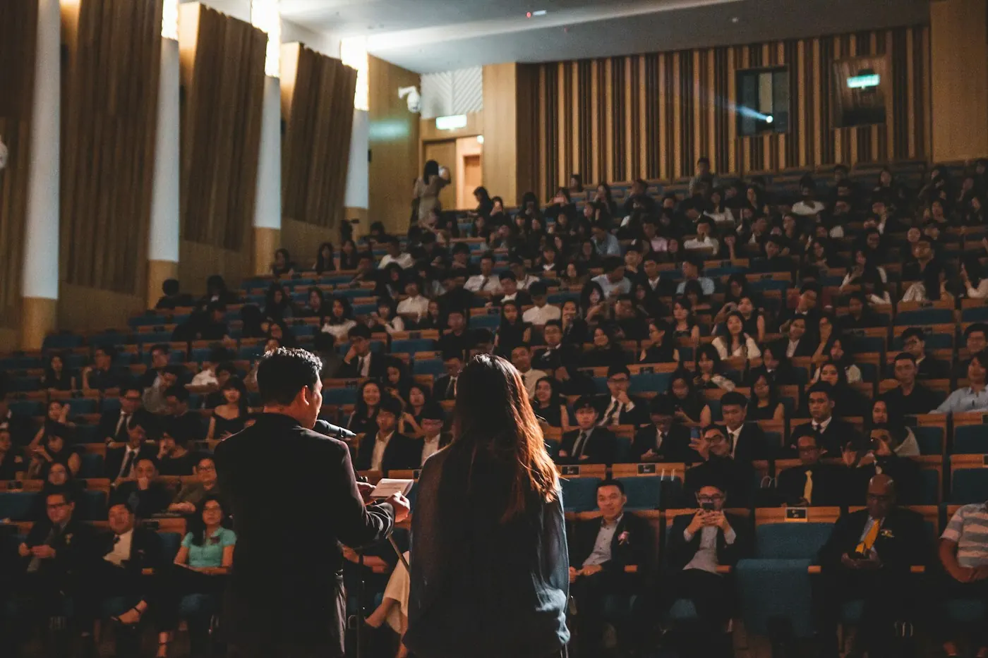 Conference audience facing a presenter