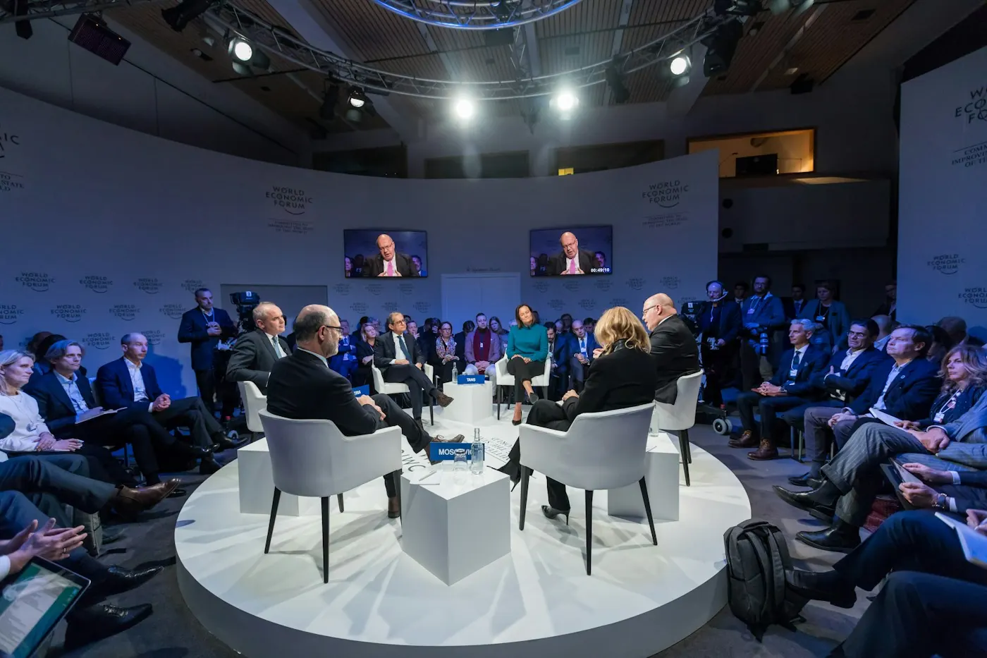 Panelists and guests in an intimate conference discussion